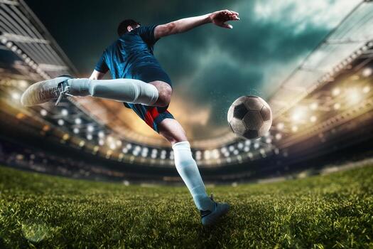 football-scene-at-night-match-with-player-kicking-the-ball-with-power-photo football-scene-at-night-match-with-player-kicking-the-ball-with-power-photo